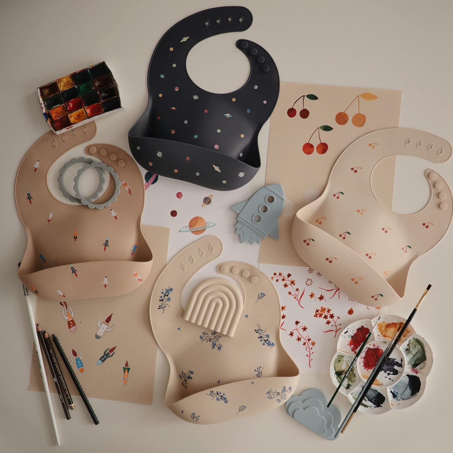 mushie Silicone Baby Bib | Adjustable Fit Waterproof Bibs (Rocket Ship)
