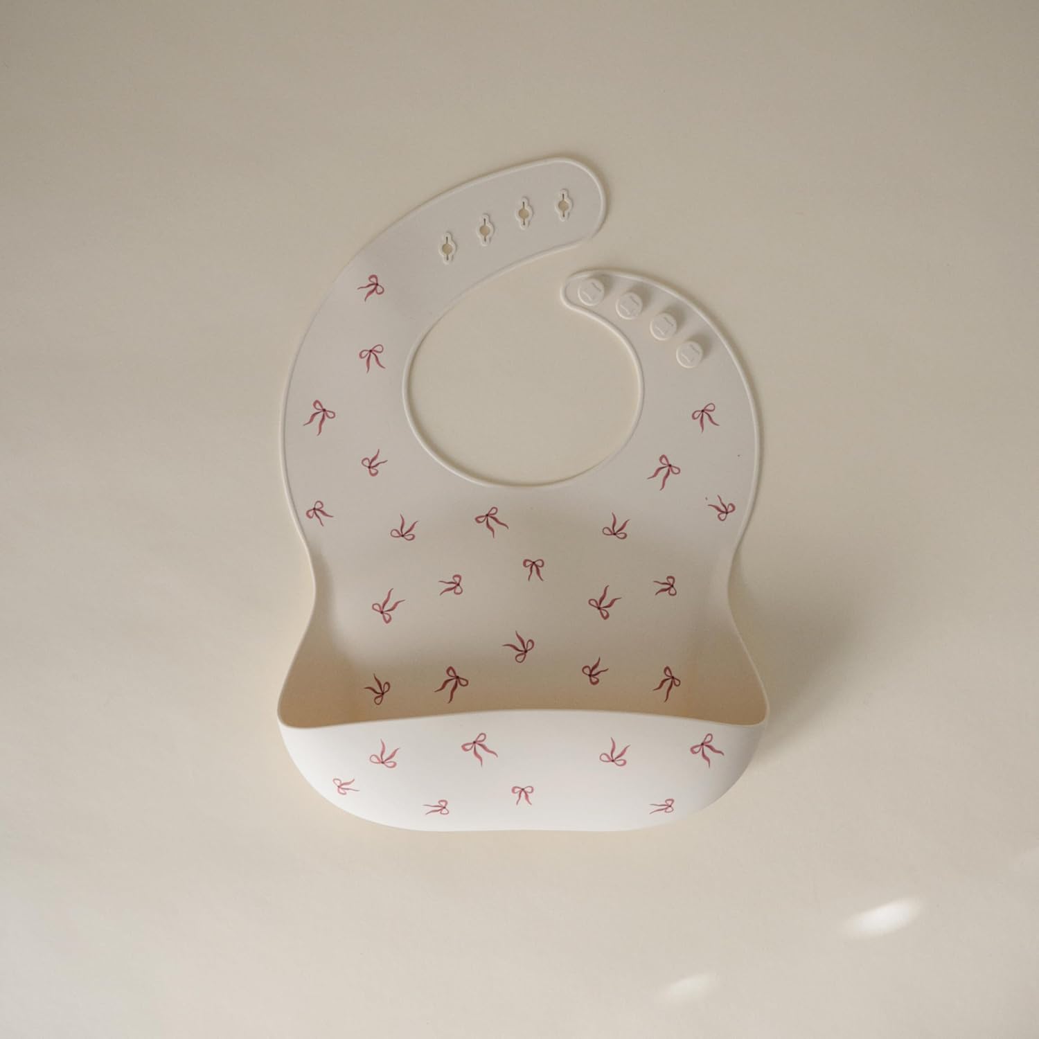 mushie Silicone Baby Bib | Adjustable Fit Waterproof Bibs (Bows)