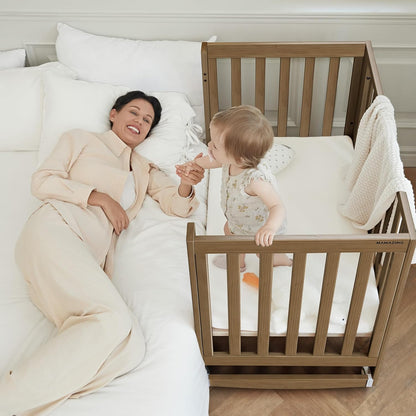 EvoNest Baby Crib, 11 in 1 Convertible Mini Crib with Wheels, 100% New Zealand Wood Growing Bed, 4 Adjustable Mattress Height ，Walnut Brown