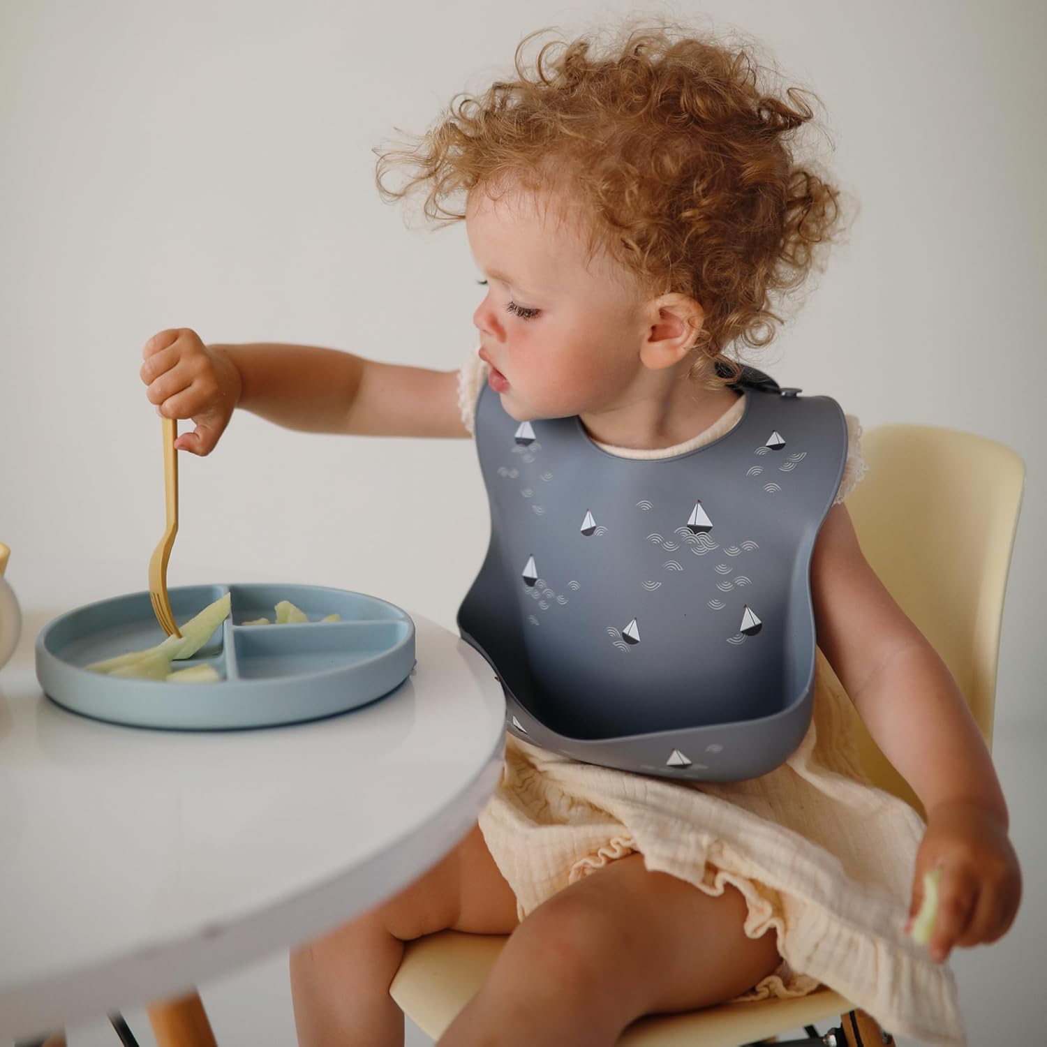 mushie Silicone Baby Bib | Adjustable Fit Waterproof Bibs (Planets)